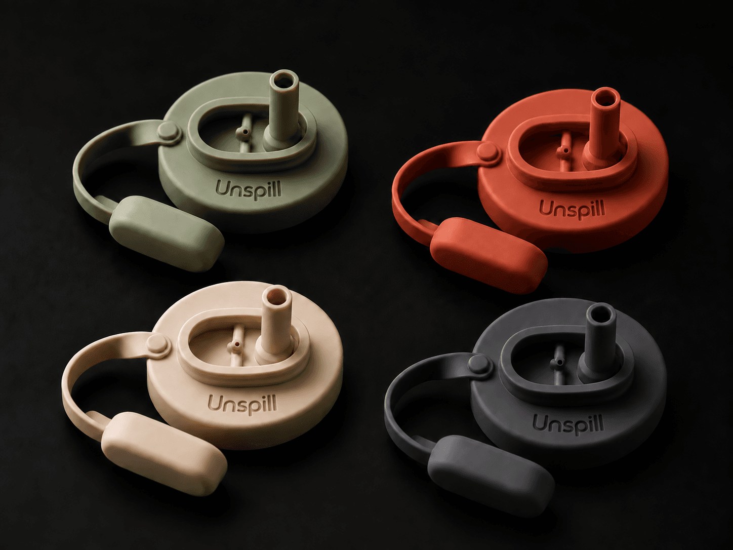 Four Unspill can covers in Sage, Terracotta, Oat, and Charcoal